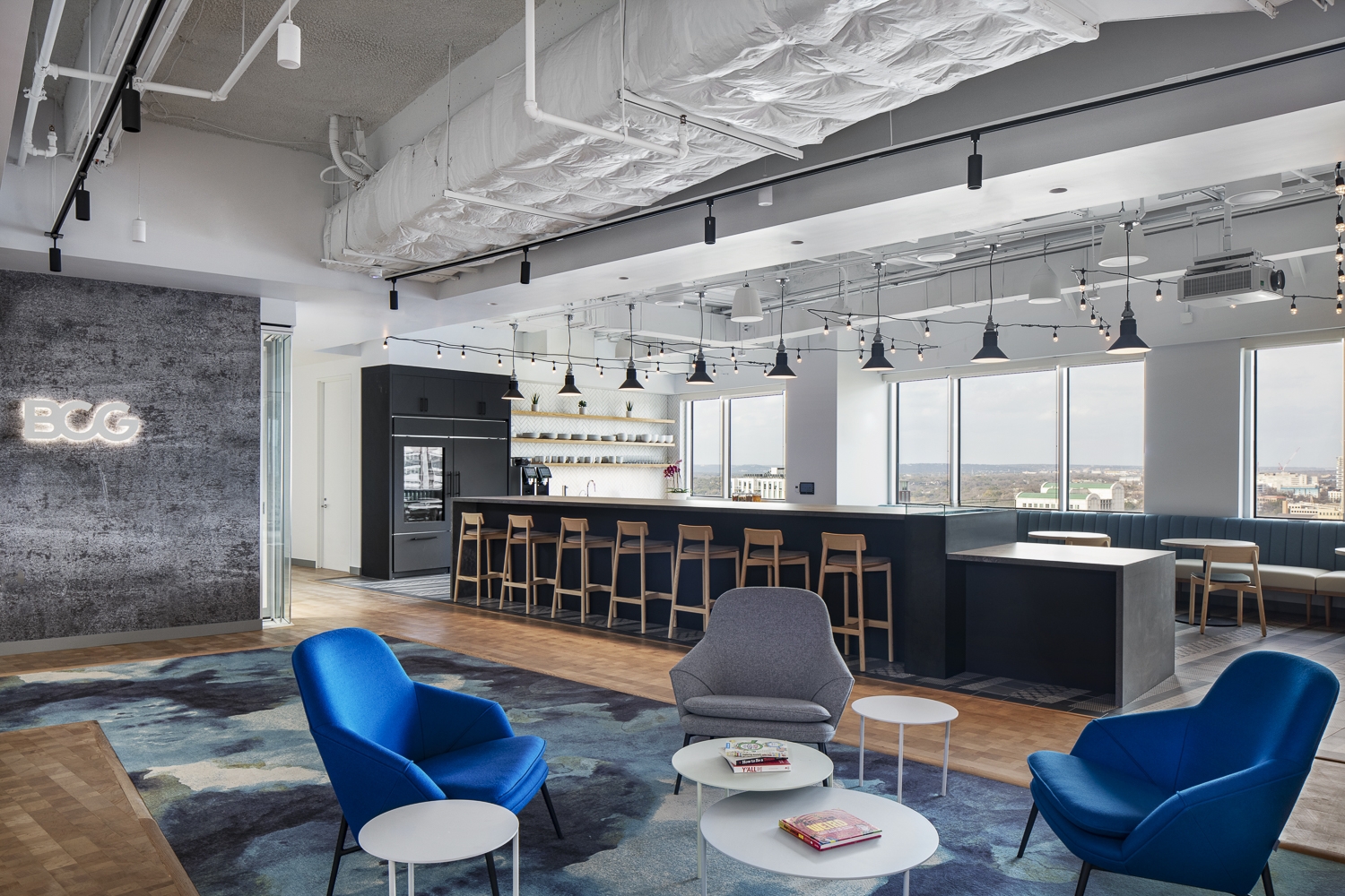 Boston Consulting Group Austin lounge with seating and café beyond