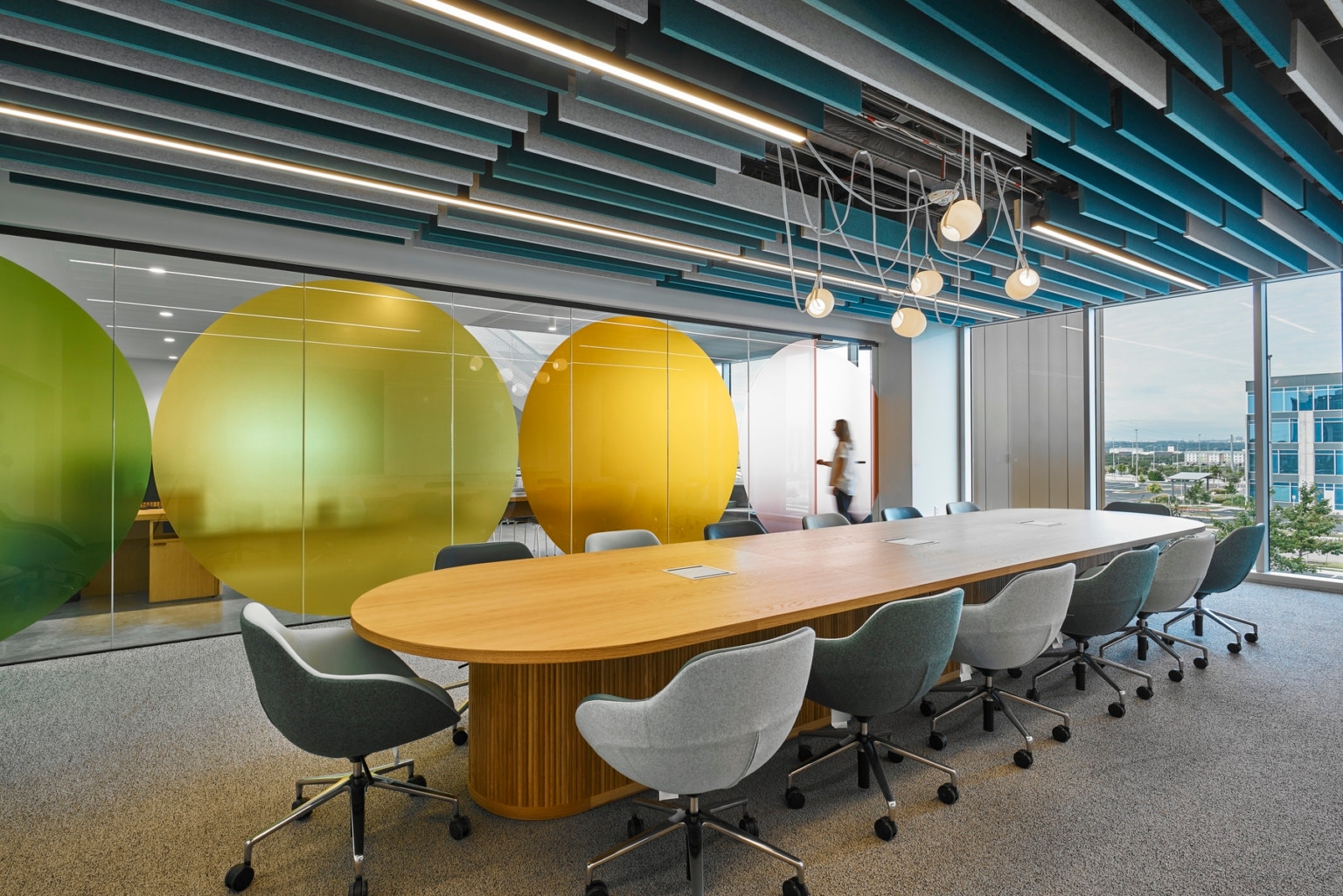 Wipro Austin conference room with a long wood table and upholstered chairs