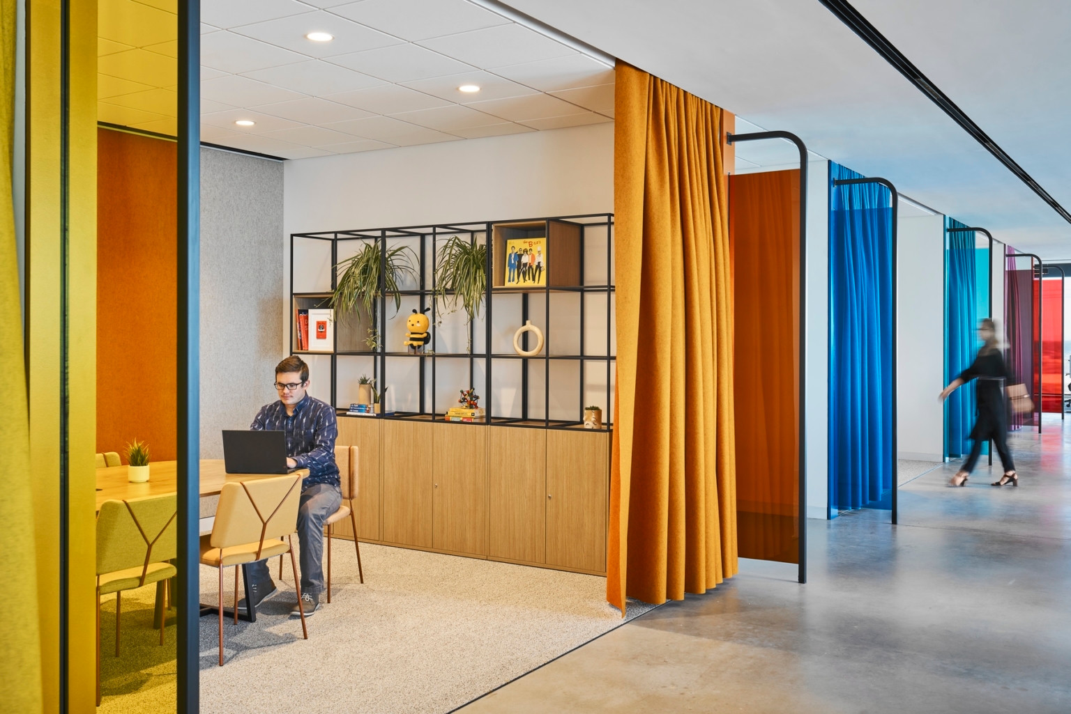 Wipro Austin focus space with yellow seating and colorful curtains