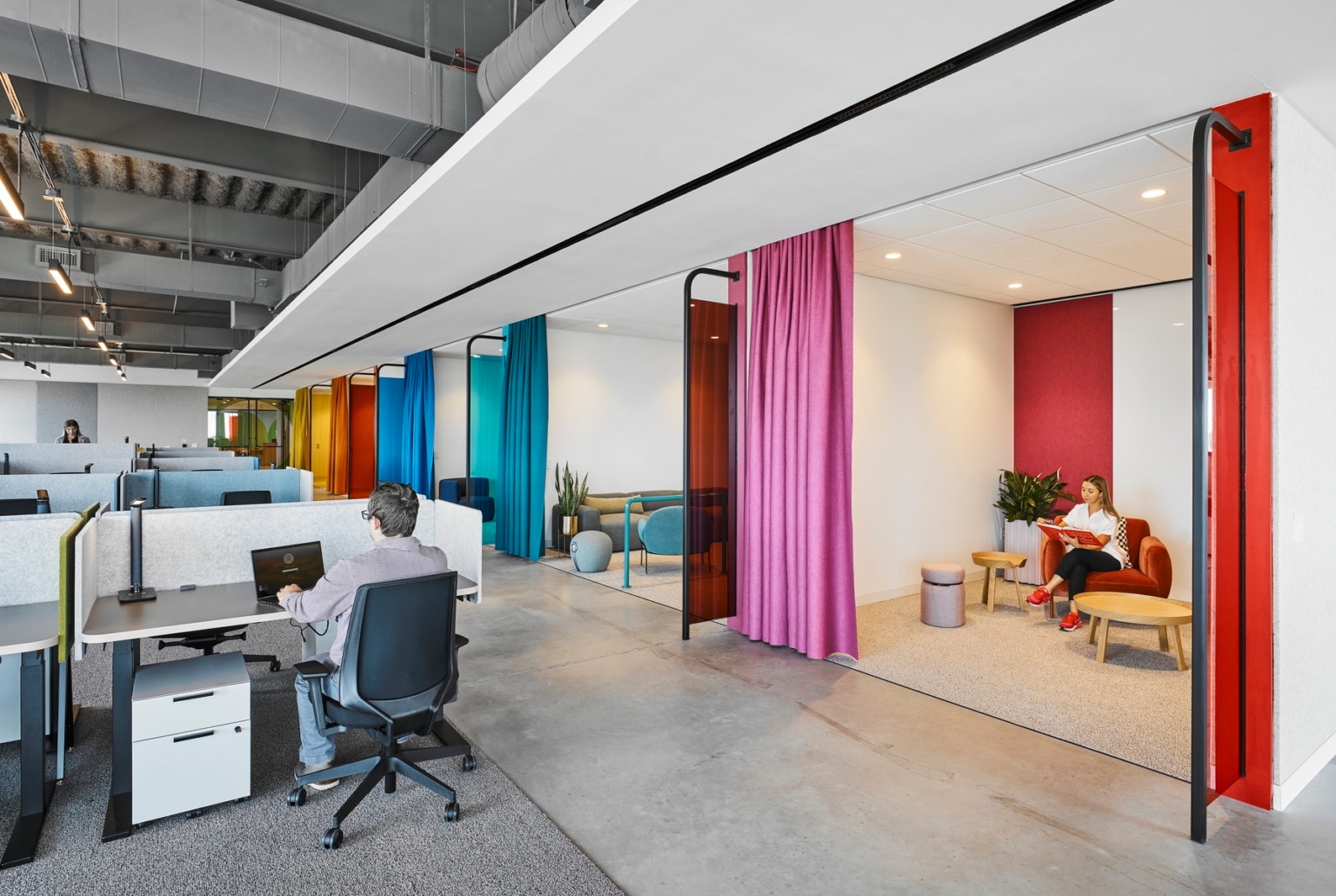 Wipro Austin workstations beside colorful lounge spaces